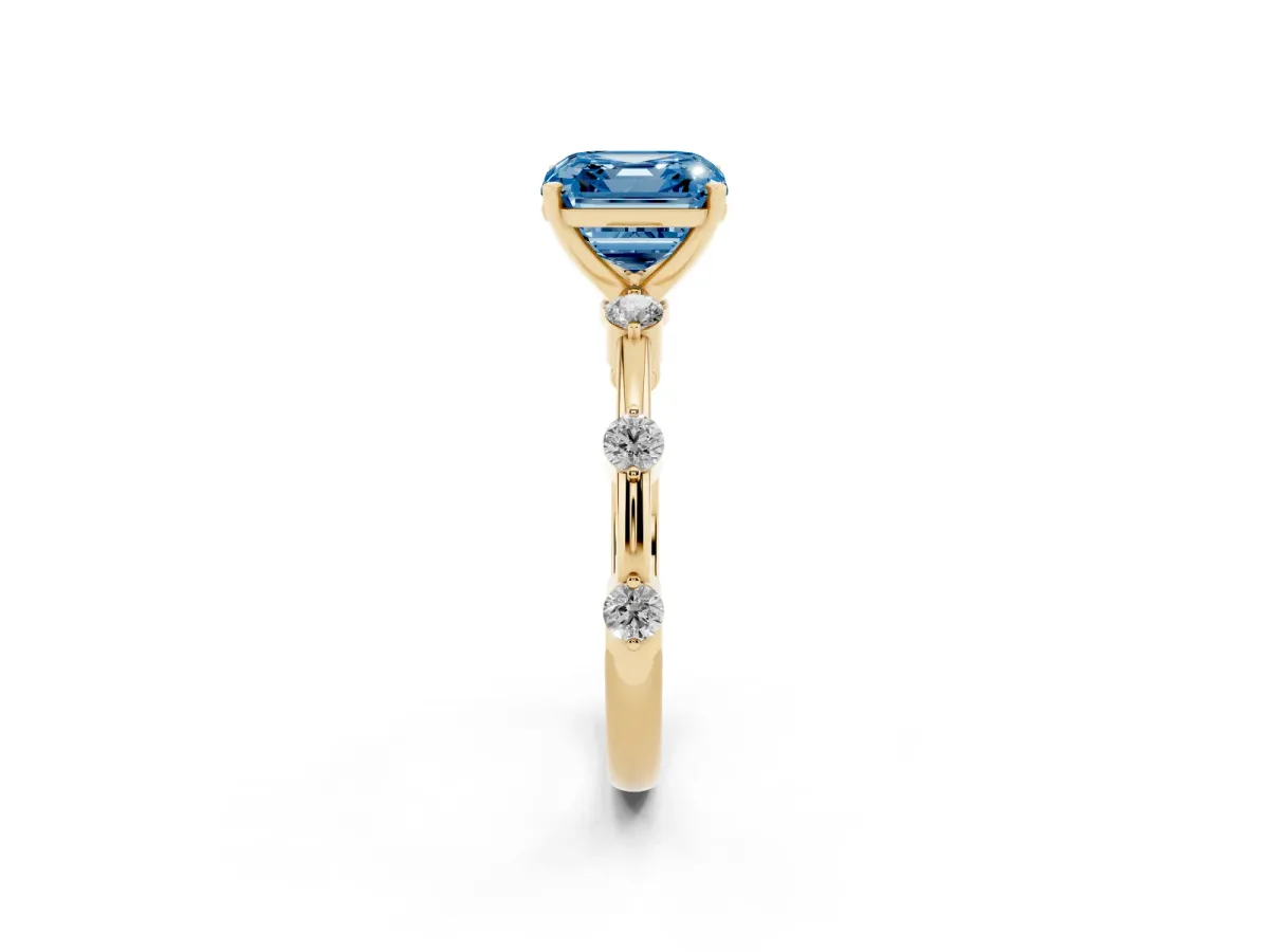 Fancy Blue Asscher Cut Solitaire Diamond Ring with Bezel Set Side Stones and Prong Setting Yellow gold
