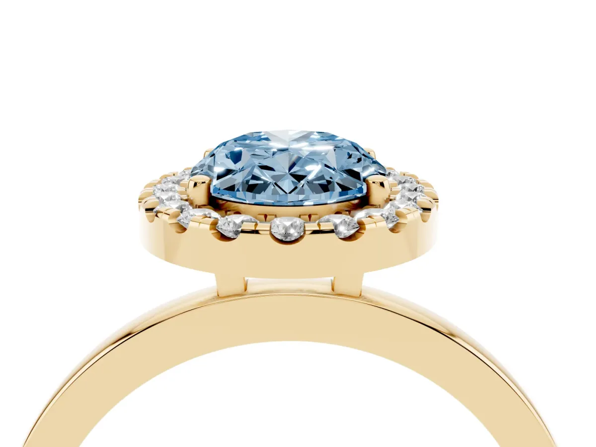Fancy Blue Oval Cut Halo Diamond Solitaire with Pavé Band and Four-Prong Setting Yellow gold