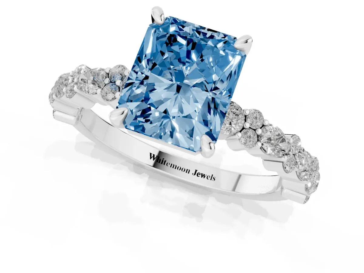Fancy Blue Radiant Cut Diamond Side Stone Solitaire Ring with Round and Four-Prong Setting Platinum