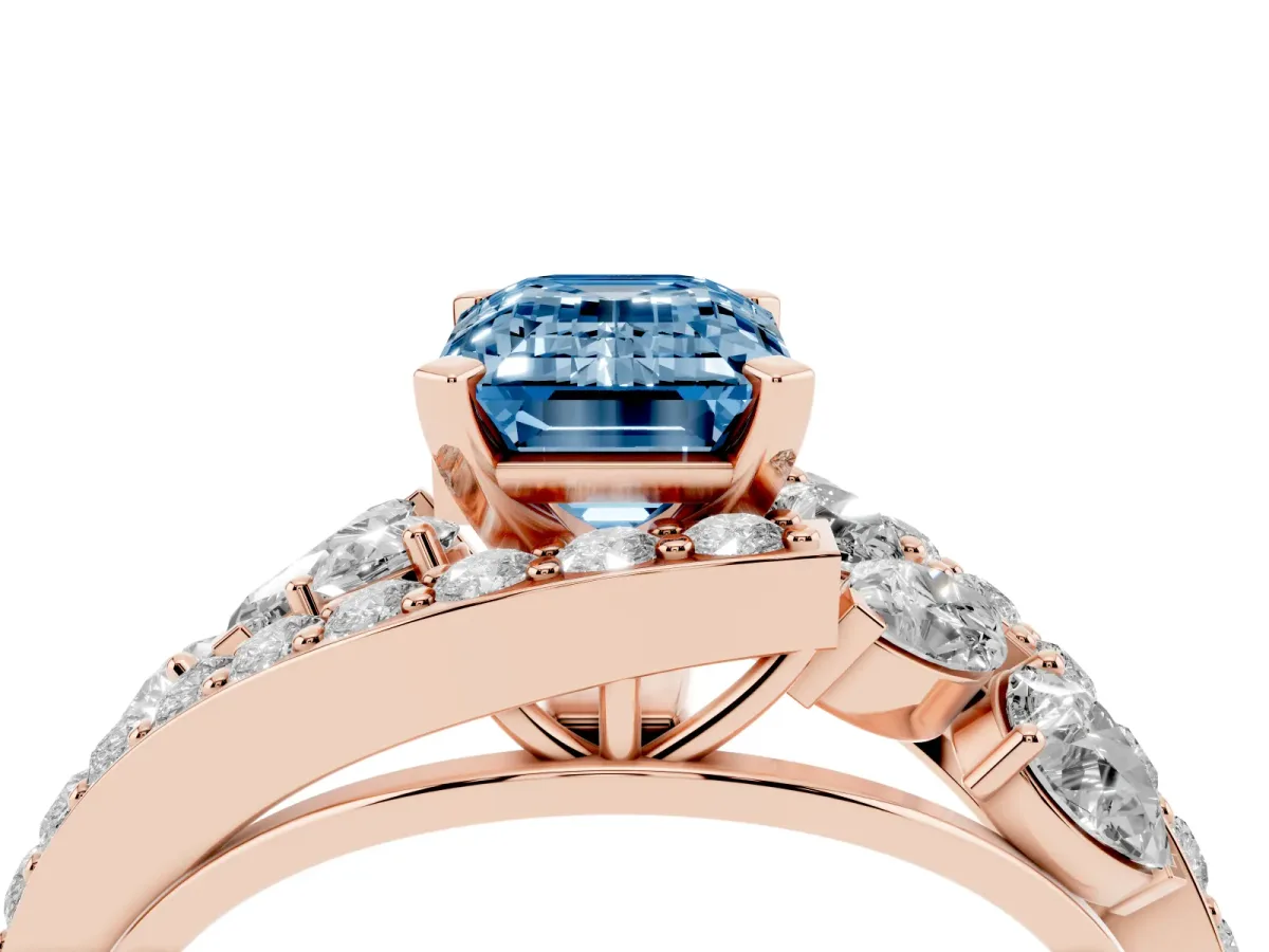 Fancy Blue Emerald Cut Diamond Halo Ring with Marquise and Pavé Band in Prong Setting Rose gold