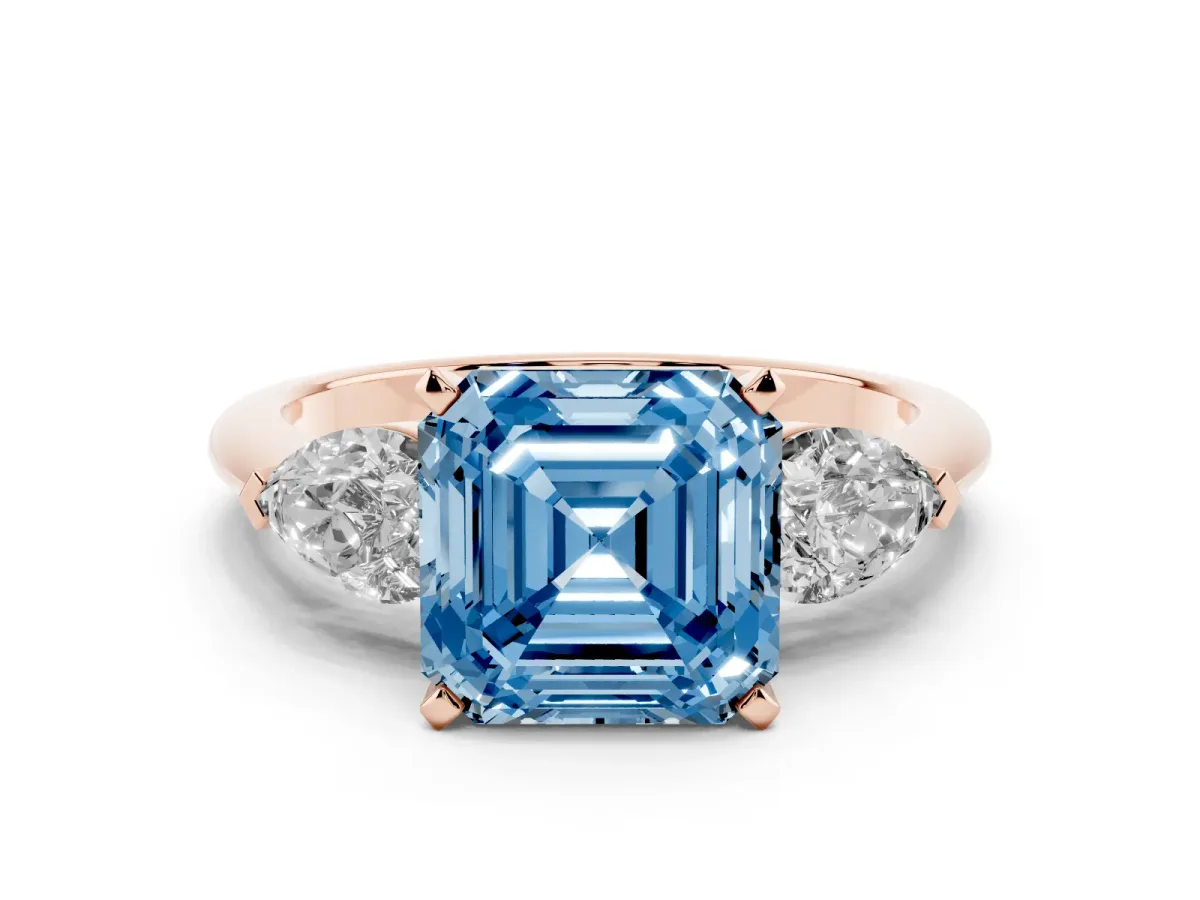 Fancy Blue Three-Stone Asscher Cut Diamond Ring with Pear Side Stones and Four-Prong Setting Rose gold