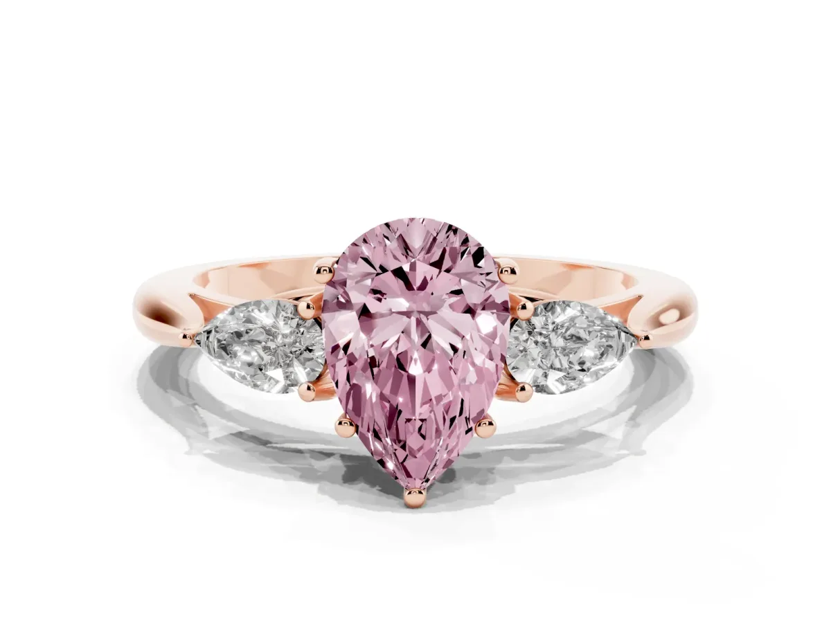 Fancy Pink Three-Stone Pear Cut Brilliant Diamond Solitaire Ring with Tapered Band and Four-Prong Setting Rose gold