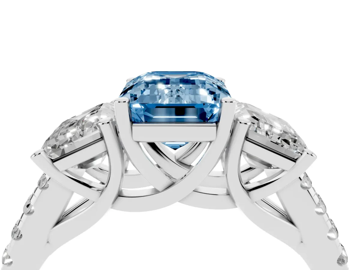 Fancy Blue Three-Stone Emerald Cut Diamond Ring with Round Pavé Band and Prong Setting Silver