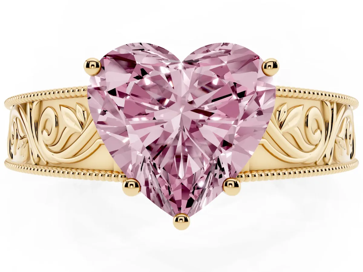 Fancy Pink Heart Cut Diamond Solitaire Ring with Engraved Band and Four-Prong Setting Yellow gold