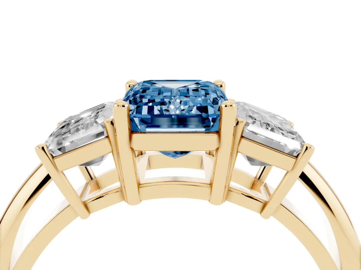 Fancy Blue Three-Stone Emerald Cut Cut Diamond Engagement Ring with Prong Setting on a White Gold Band Yellow gold