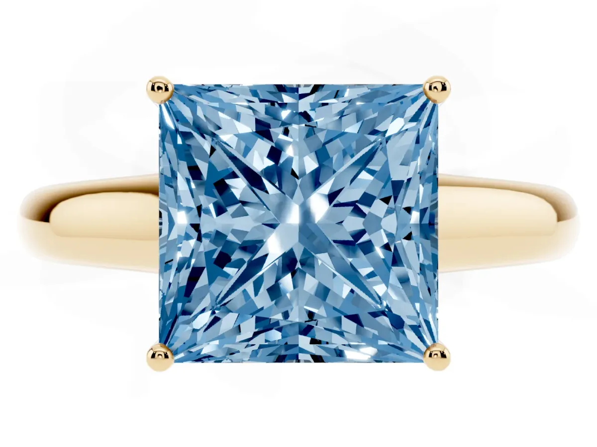 Fancy Blue Princess Cut Solitaire Engagement Ring with Tapered Band and Four-Prong Setting Yellow gold