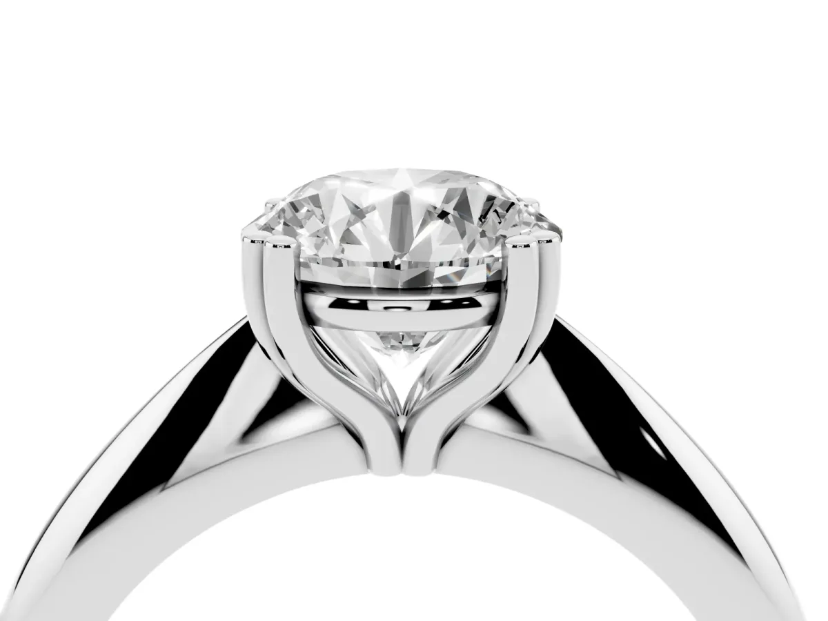 Round Cut Cut Solitaire Engagement Ring with Tapered Band and Four-Prong Setting Platinum