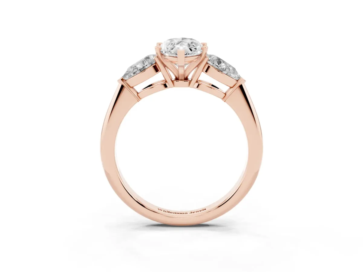 Three-Stone Marquise Cut Diamond Ring with Pear Side Stones and Four-Prong Setting Rose gold