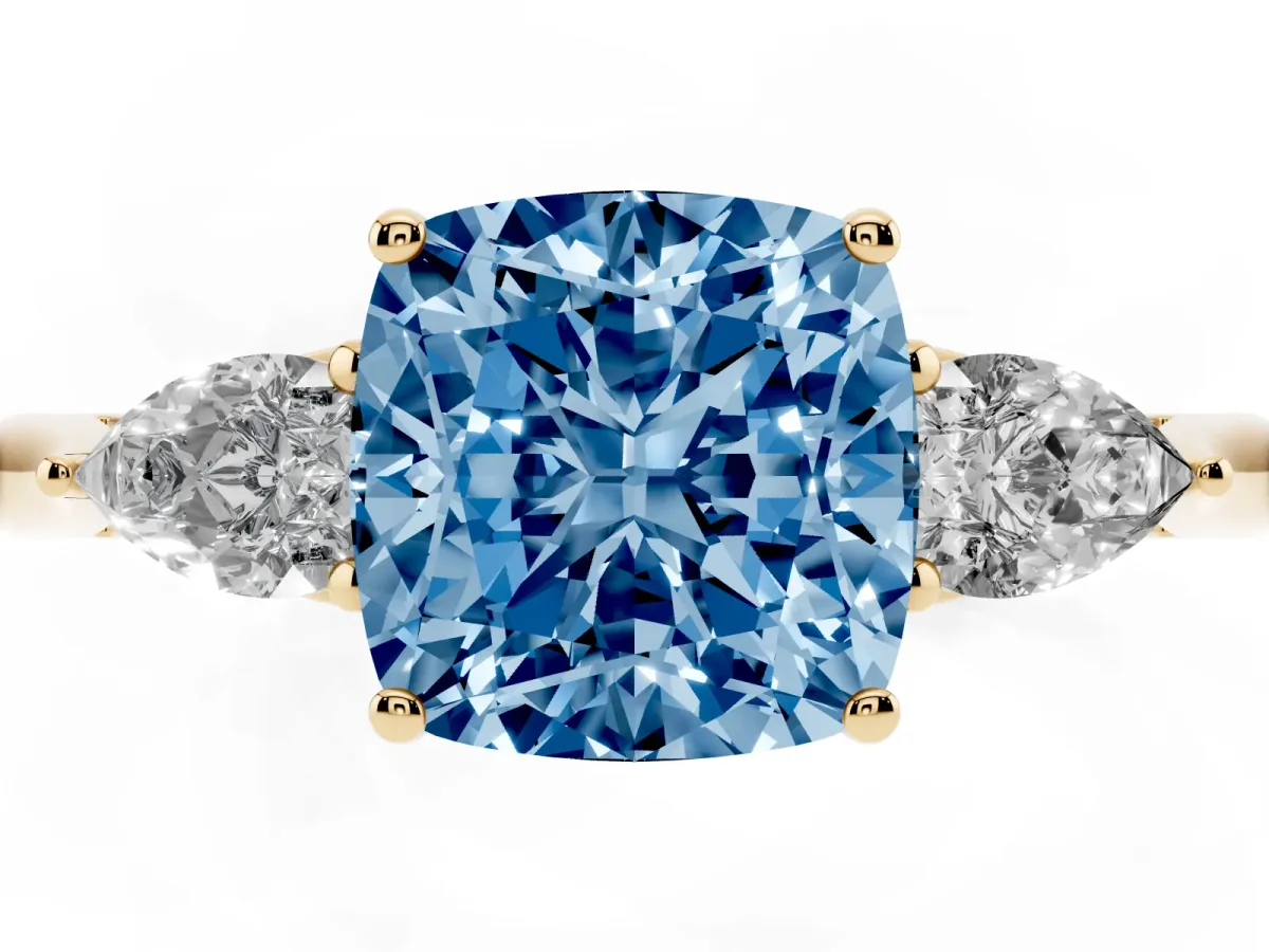 Fancy Blue Three-Stone Cushion Cut Brilliant Diamond Solitaire Ring with Tapered Band and Four-Prong Setting Yellow gold