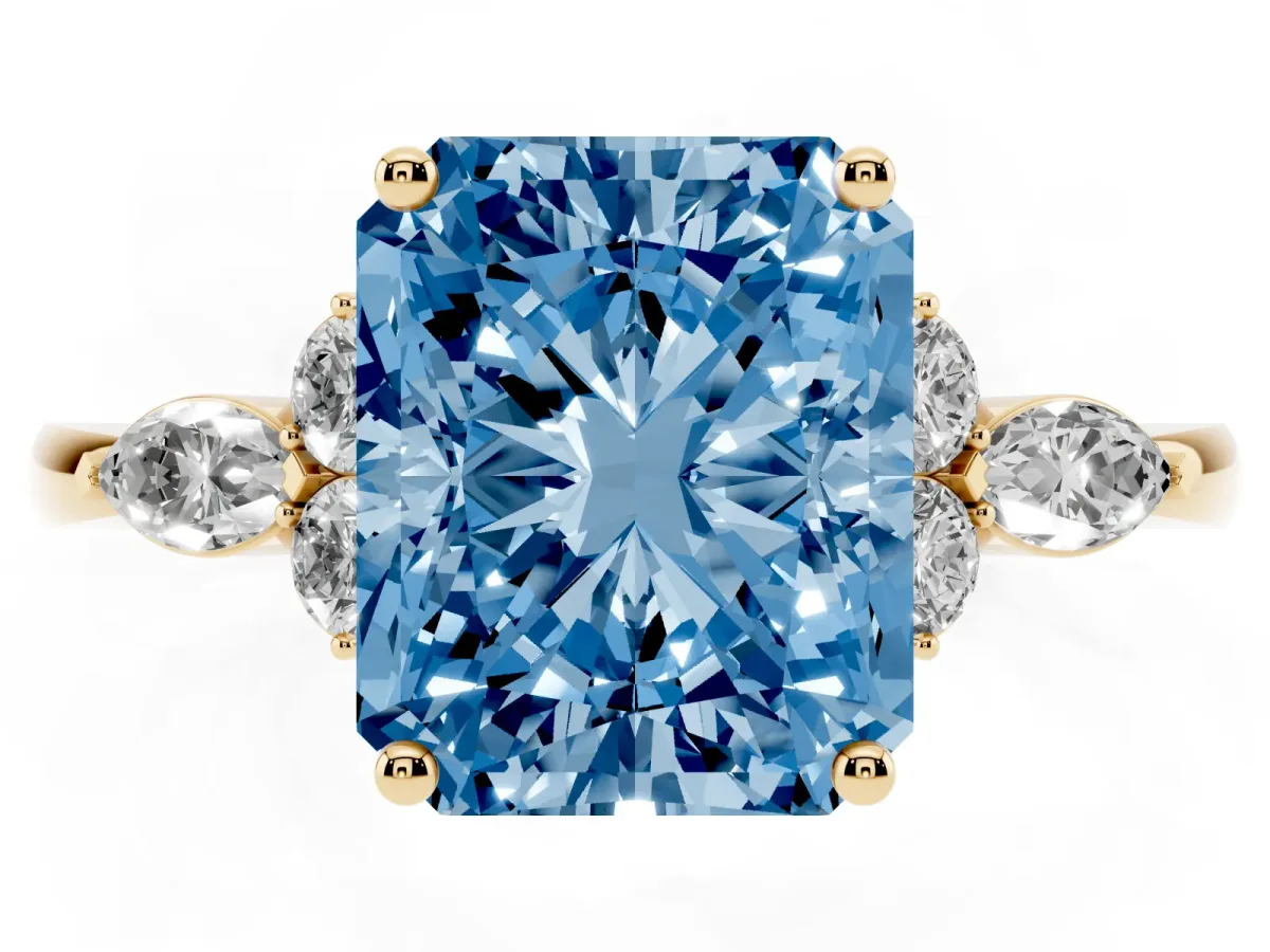 Fancy Blue Radiant Cut Brilliant Diamond Solitaire Ring with Pear Side Stones and Four-Prong Setting Yellow gold