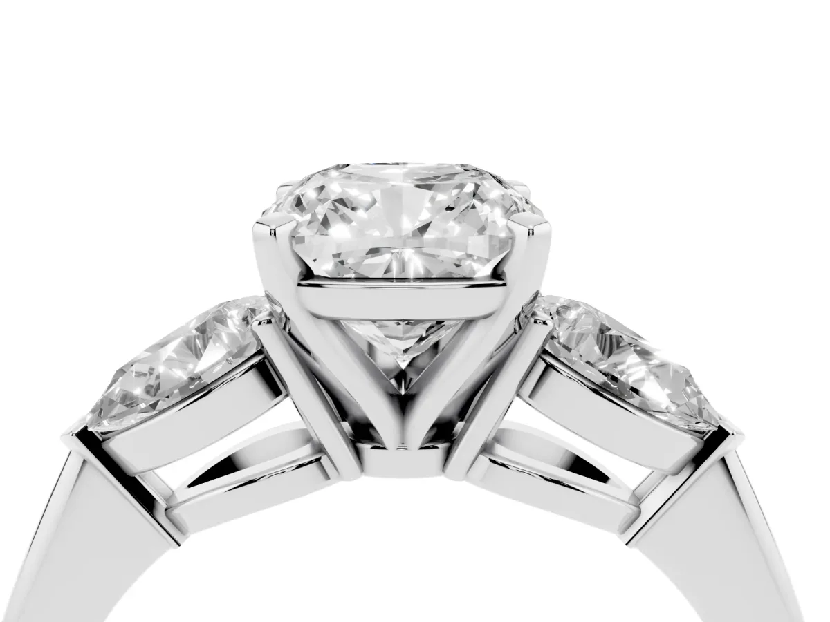 Three-Stone Cushion Cut Diamond Ring with Pear Side Stones and Four-Prong Setting Platinum