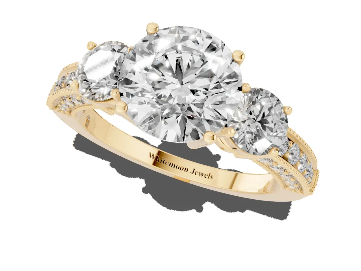 Round Cut Three-Stone Diamond Ring with Pavé Band and Four-Prong Setting Yellow gold