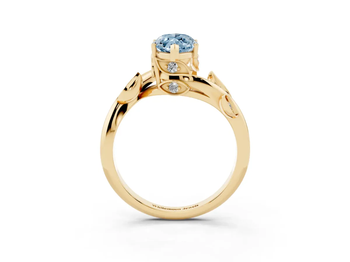 Fancy Blue Marquise Cut Solitaire Twist Engagement Ring with Leaf Accents and Prong Setting Yellow gold
