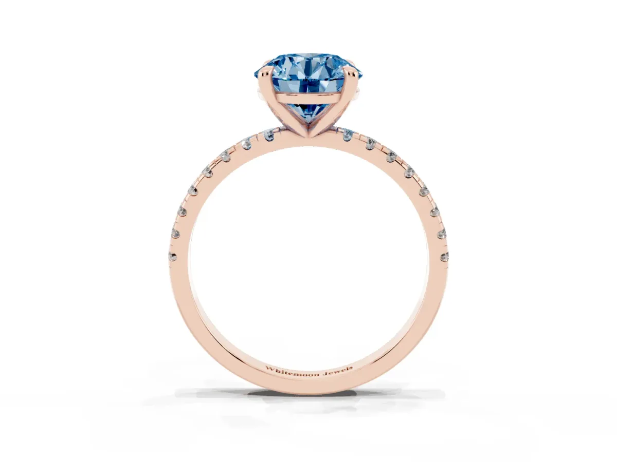 Fancy Blue Round Cut Diamond Brilliant Solitaire Ring with Pavé Band and Four-Prong Setting Rose gold