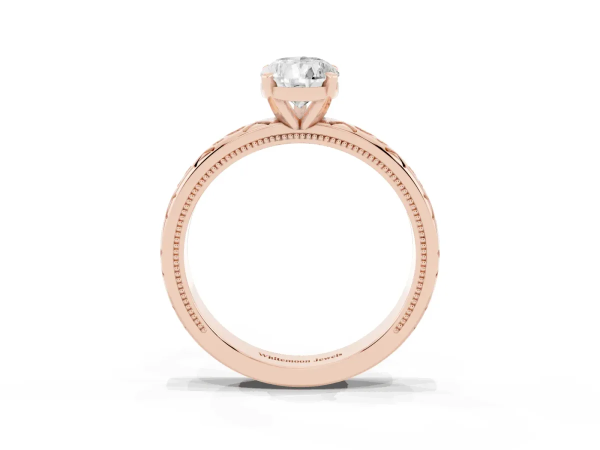 Pear Cut Solitaire Engagement Ring with Scrollwork Band and Four-Prong Setting Rose gold