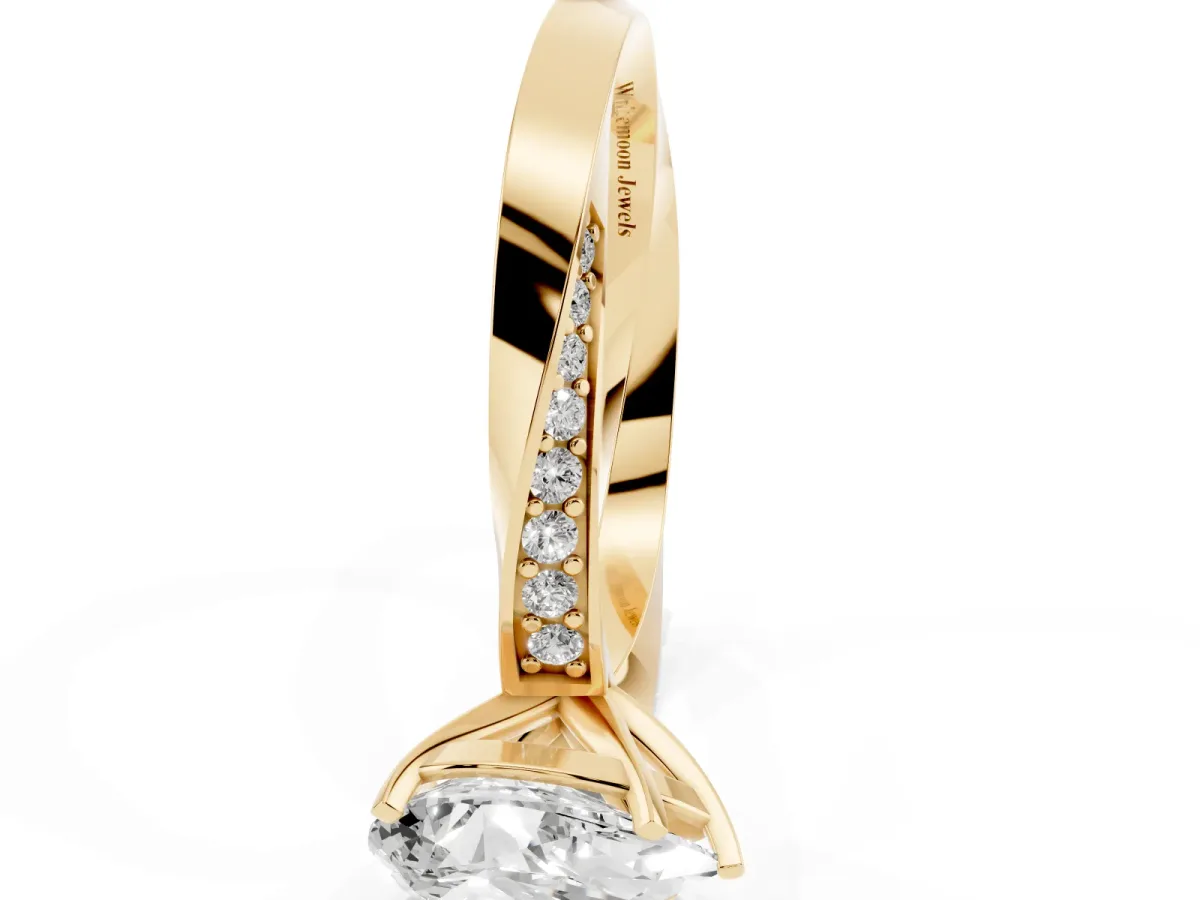 Pear Cut Diamond Engagement Ring with Side Stone Accents and Four-Prong Setting Yellow gold