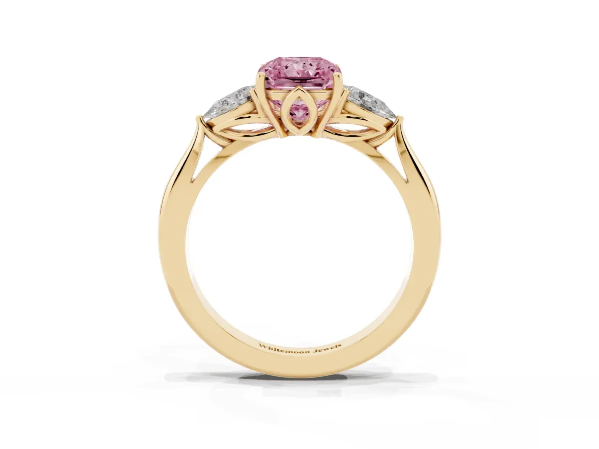 Fancy Pink Three-Stone Radiant Cut Diamond Ring with Pear Side Stones in Four-Prong Setting Yellow gold