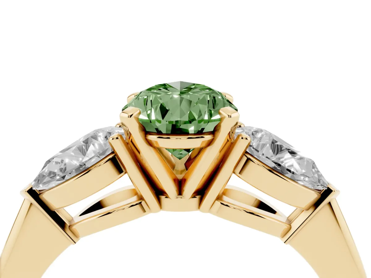 Fancy Green Three-Stone Pear Cut Diamond Ring with Pear Side Stones and Four-Prong Setting Yellow gold