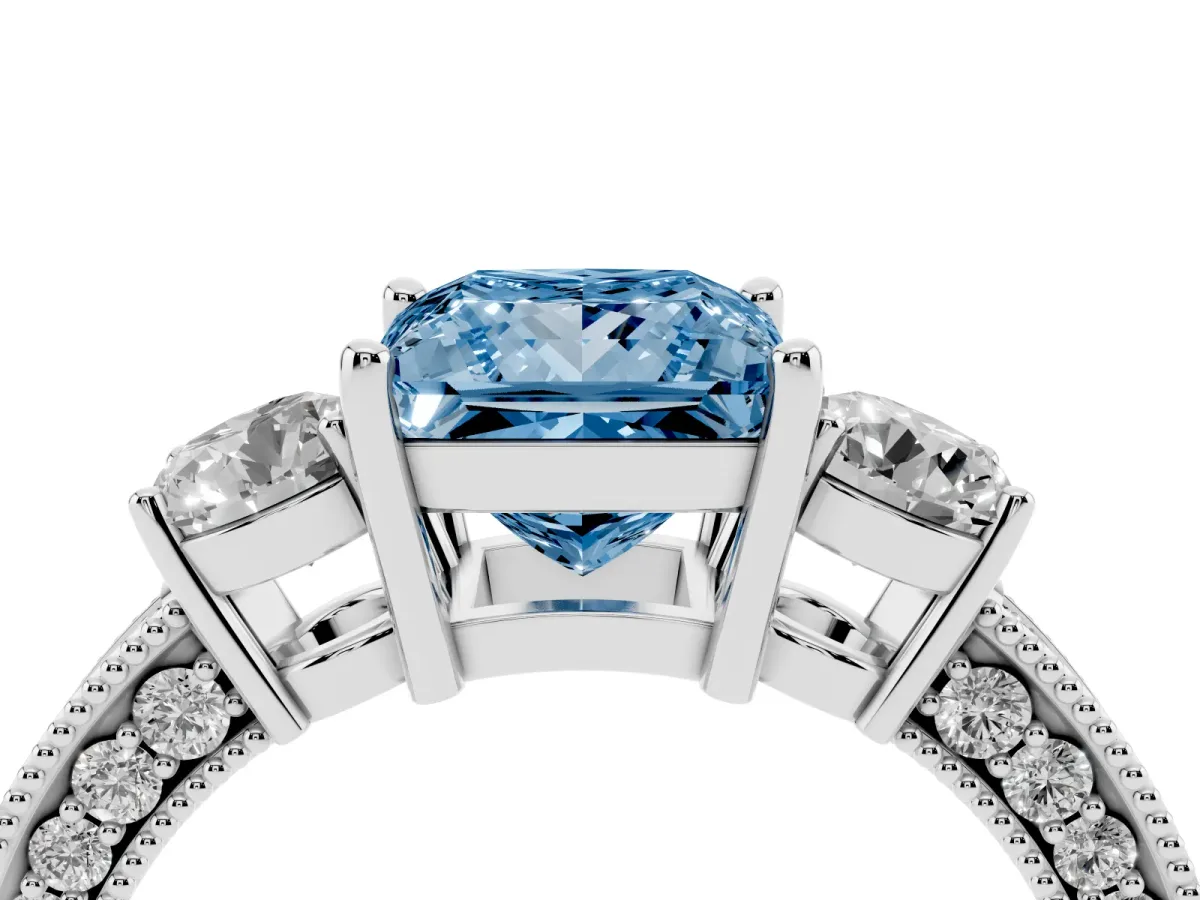 Fancy Blue Princess Cut Three-Stone Diamond Ring with Pavé Band and Four-Prong Setting Silver