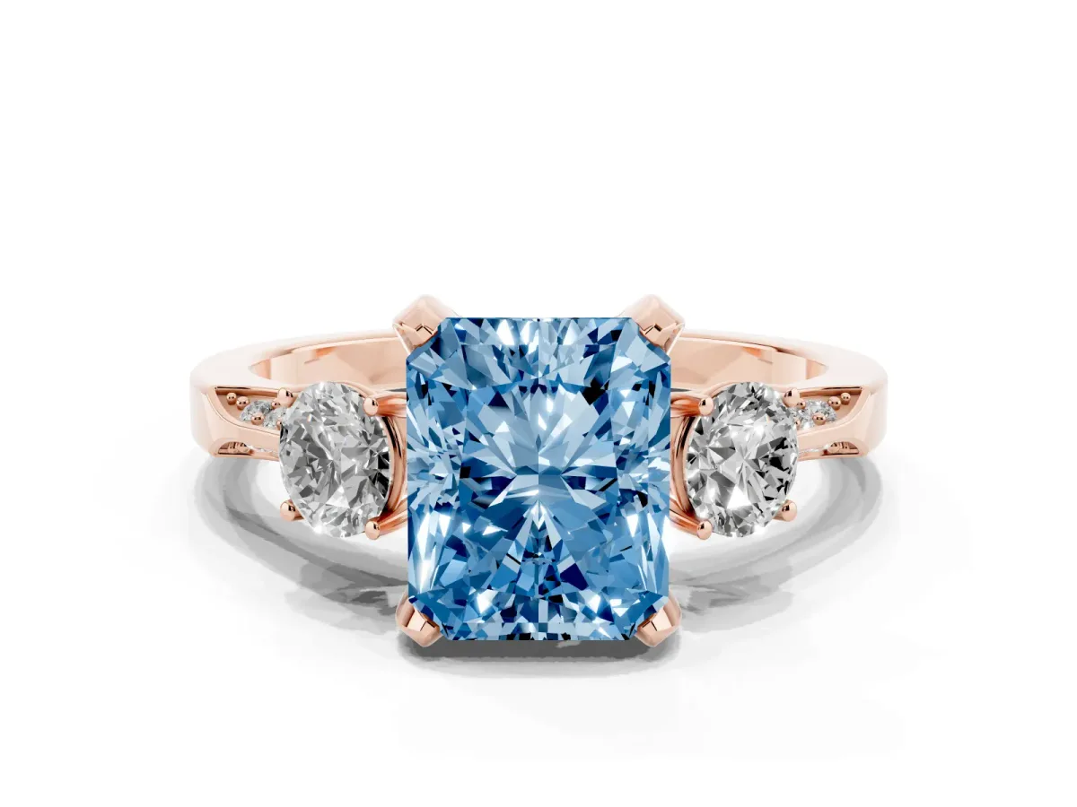 Fancy Blue Radiant Cut Brilliant Three-Stone Diamond Ring with Pavé Band and Four-Prong Setting Rose gold