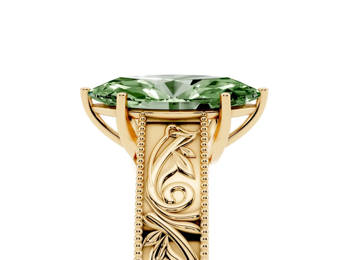 Fancy Green Marquise Cut Diamond Solitaire Ring with Engraved Band and Four-Prong Setting Yellow gold