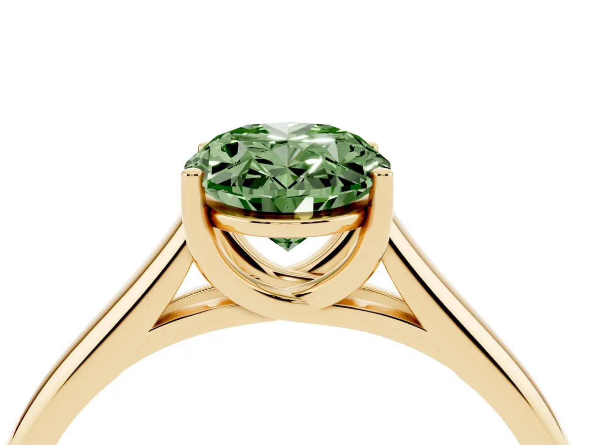 Fancy Green Oval Cut Solitaire Engagement Ring with Tapered Band and Four-Prong Setting Yellow gold
