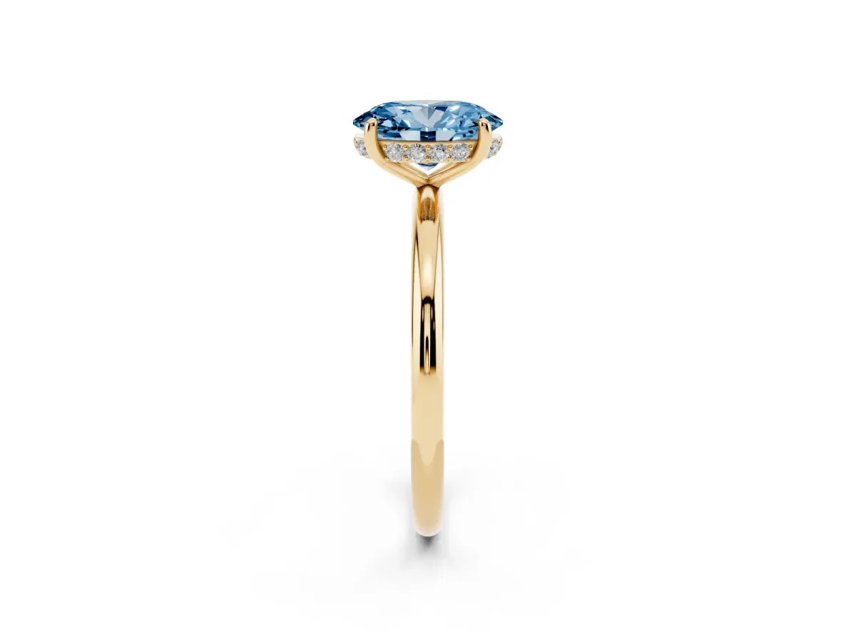 Fancy Blue Oval Cut Solitaire Diamond Ring with a Classic Band and Four-Prong Setting Yellow gold