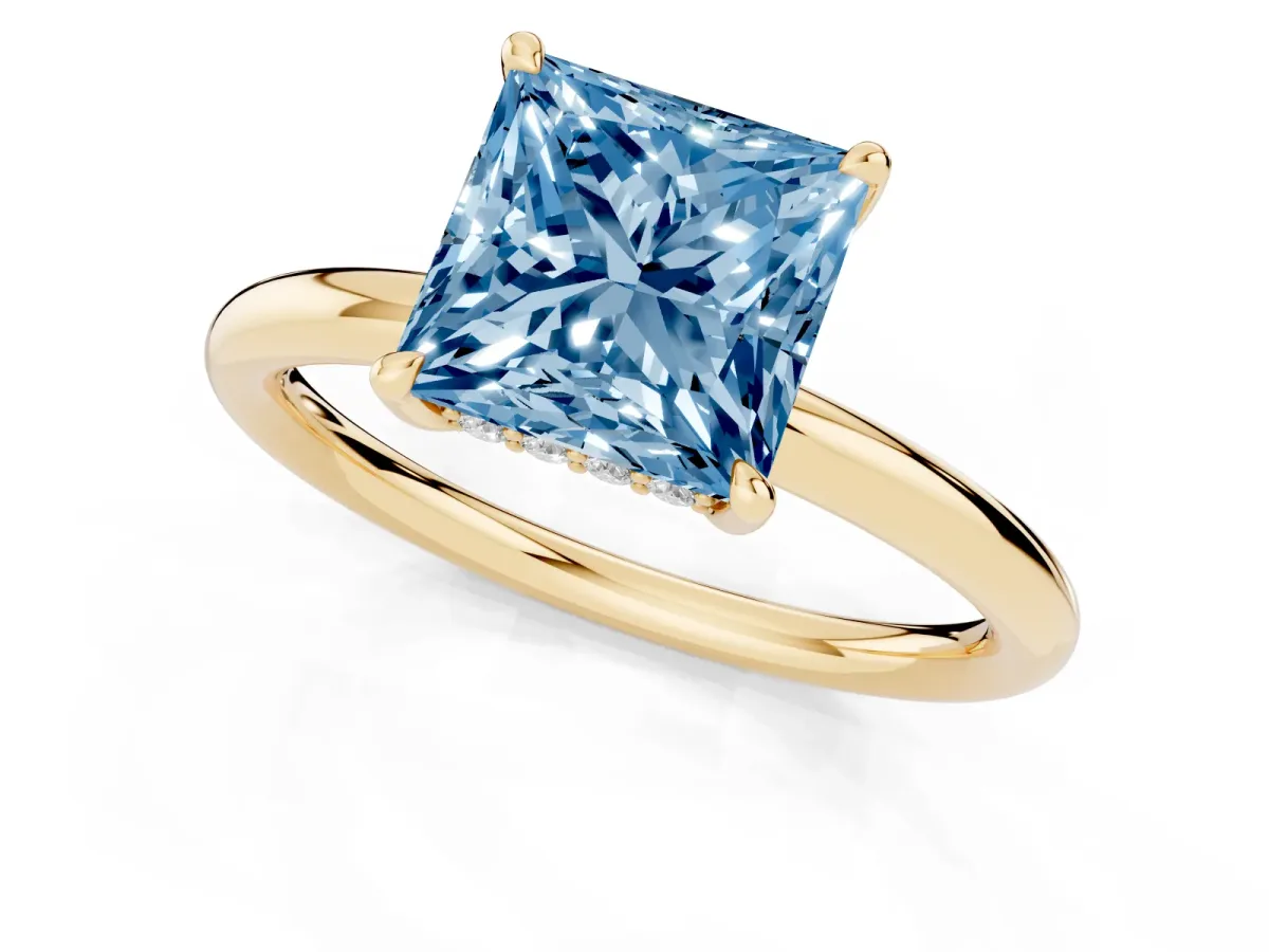 Fancy Blue Princess Cut Diamond Solitaire Ring with Thin Band and Four-Prong Setting Yellow gold