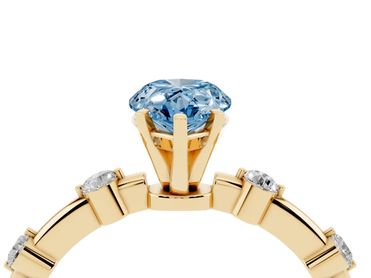 Fancy Blue Pear Cut Solitaire Diamond Ring with Bezel Set Side Stones and Prong Setting Yellow gold