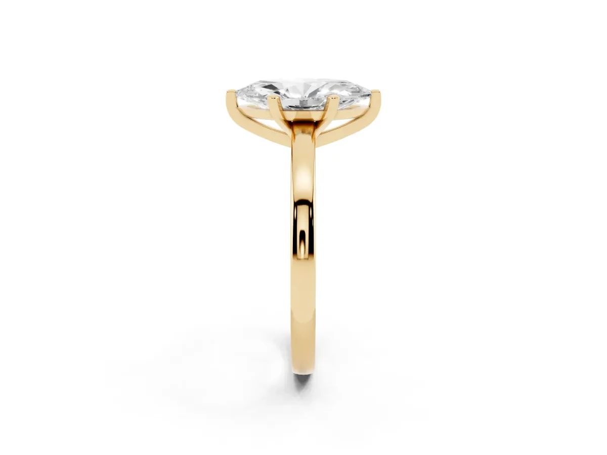 Marquise Cut Solitaire Diamond Engagement Ring with Four-Prong Setting on a Classic Band Yellow gold