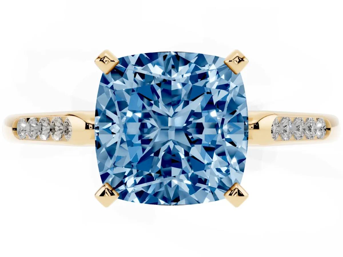 Fancy Blue Cushion Cut Diamond Solitaire Ring with Channel Set Round Band and Prong Setting Yellow gold