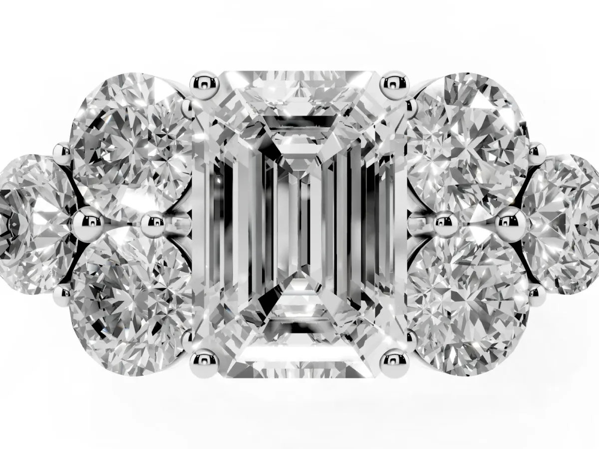 Emerald Cut Cut Diamond Cluster Ring with Round Accent Stones and Prong Setting on a Classic Band Silver