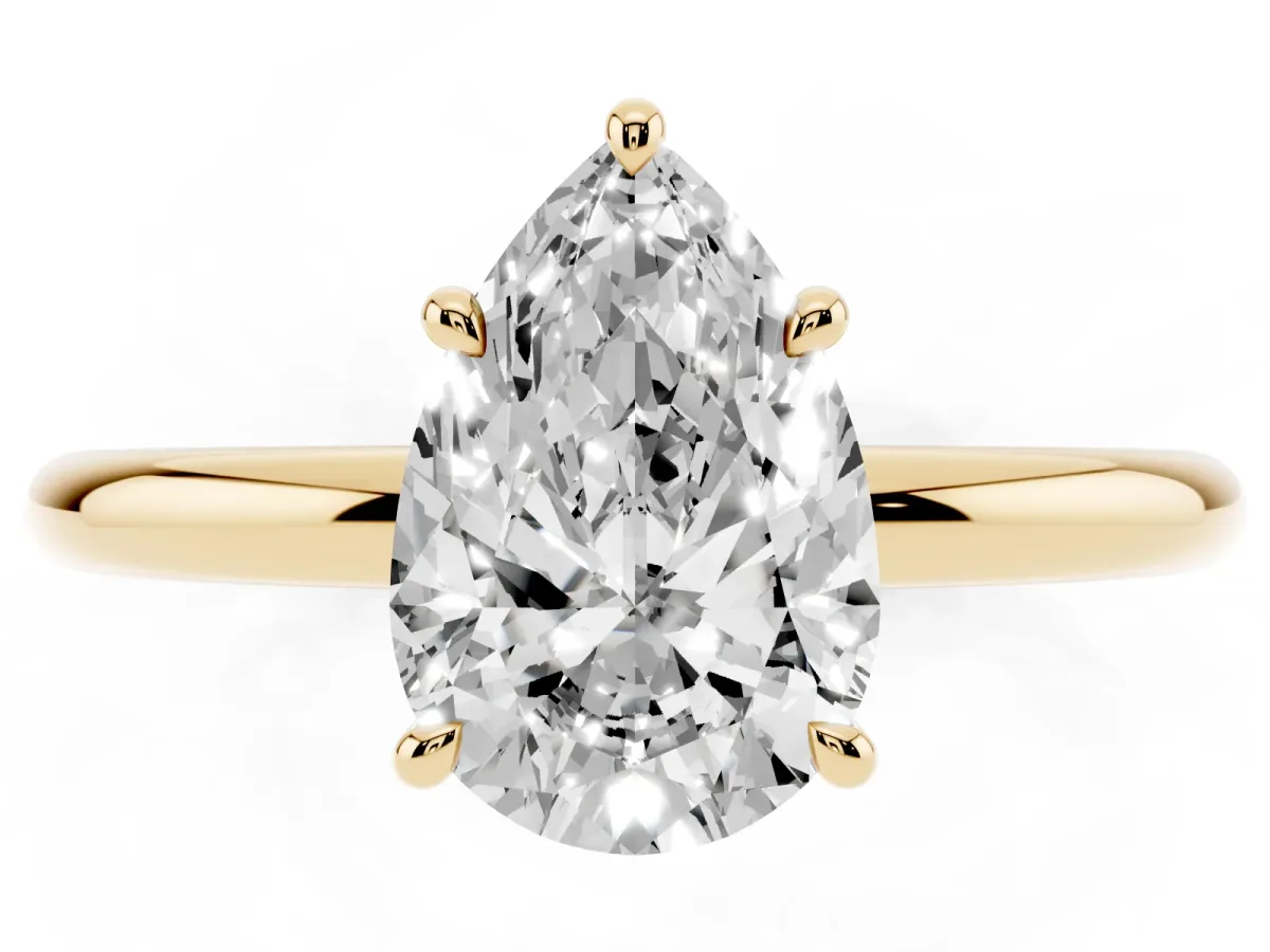 Pear Cut Diamond Solitaire Ring with Thin Band and Four-Prong Setting Yellow gold