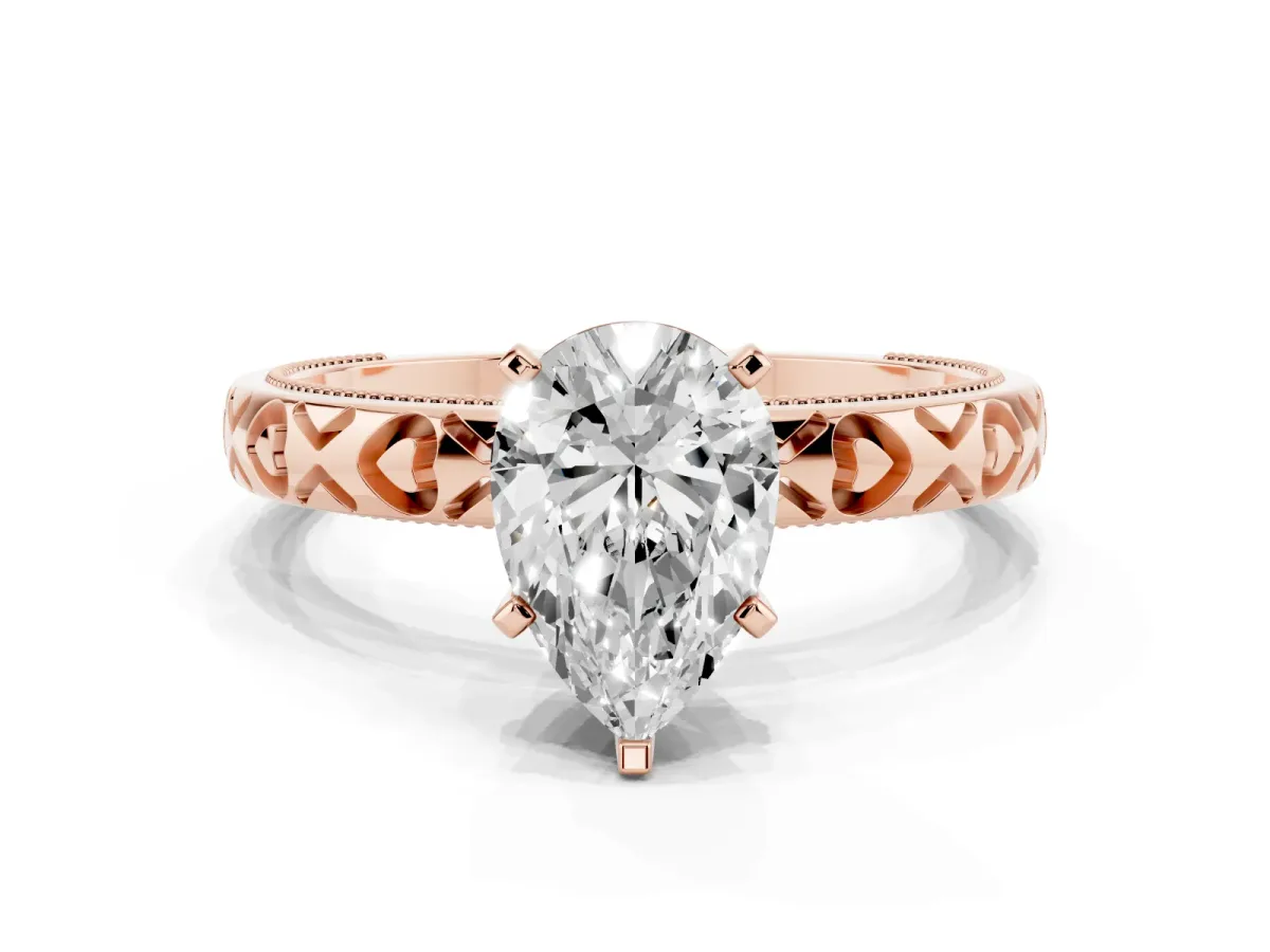 Pear Cut Solitaire Diamond Engagement Ring with XO Engraved Band and Four-Prong Setting Rose gold