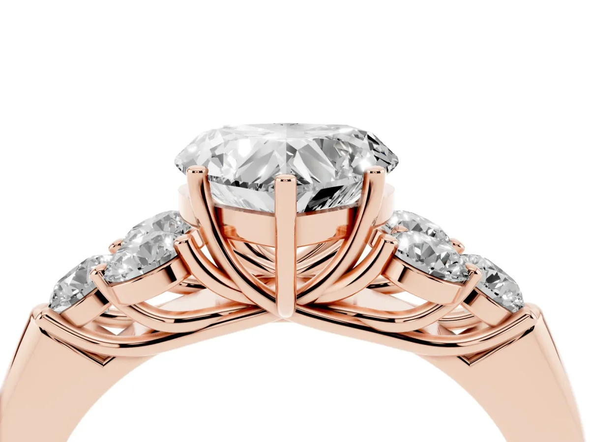 Heart Cut Cut Diamond Cluster Ring with Round Accent Stones and Prong Setting on a Classic Band Rose gold