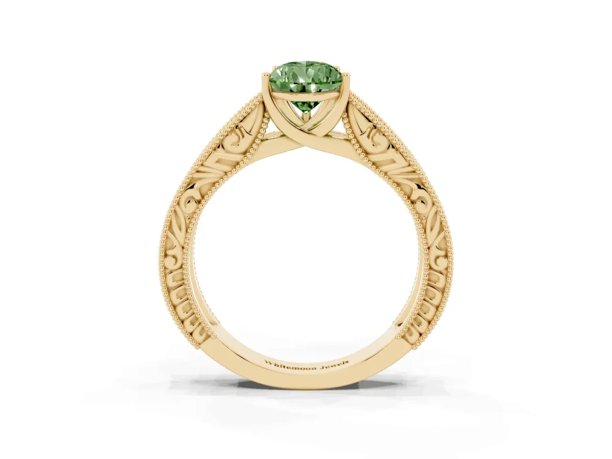 Fancy Green Pear Cut Diamond Solitaire Ring with Engraved Band and Four-Prong Setting Yellow gold