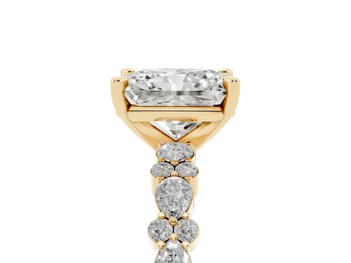 Radiant Cut Diamond Side Stone Solitaire Ring with Round and Four-Prong Setting Yellow gold