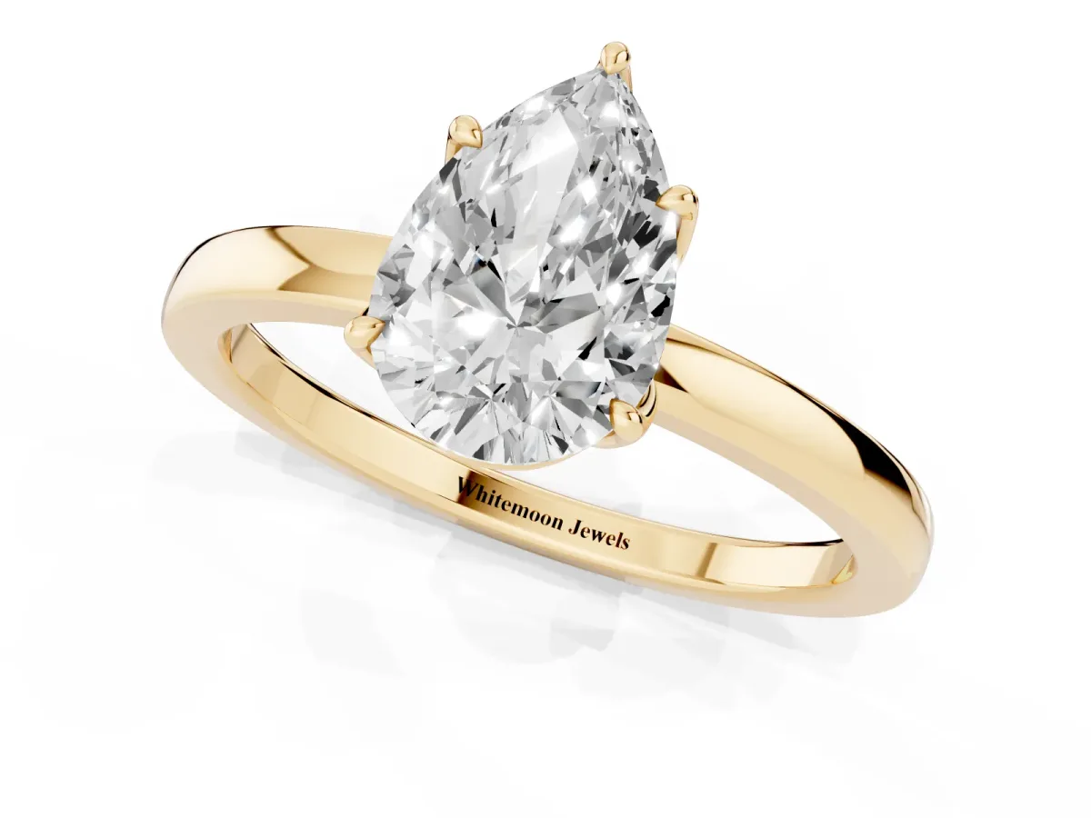 Pear Cut Diamond Solitaire Ring with Thin Band and Prong Setting Yellow gold