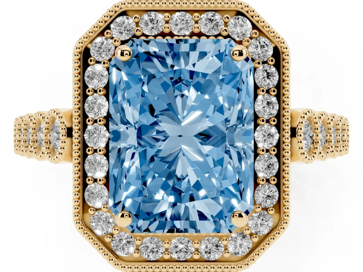 Fancy Blue Radiant Cut Halo Milgrain Solitaire with Bezel Set Side Stones and Pave Band Yellow gold