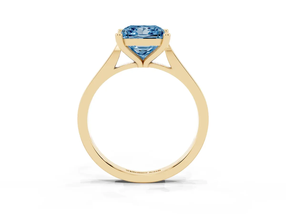 Fancy Blue Princess Cut Solitaire Diamond Ring with Four-Prong Setting and Tapered Band Yellow gold