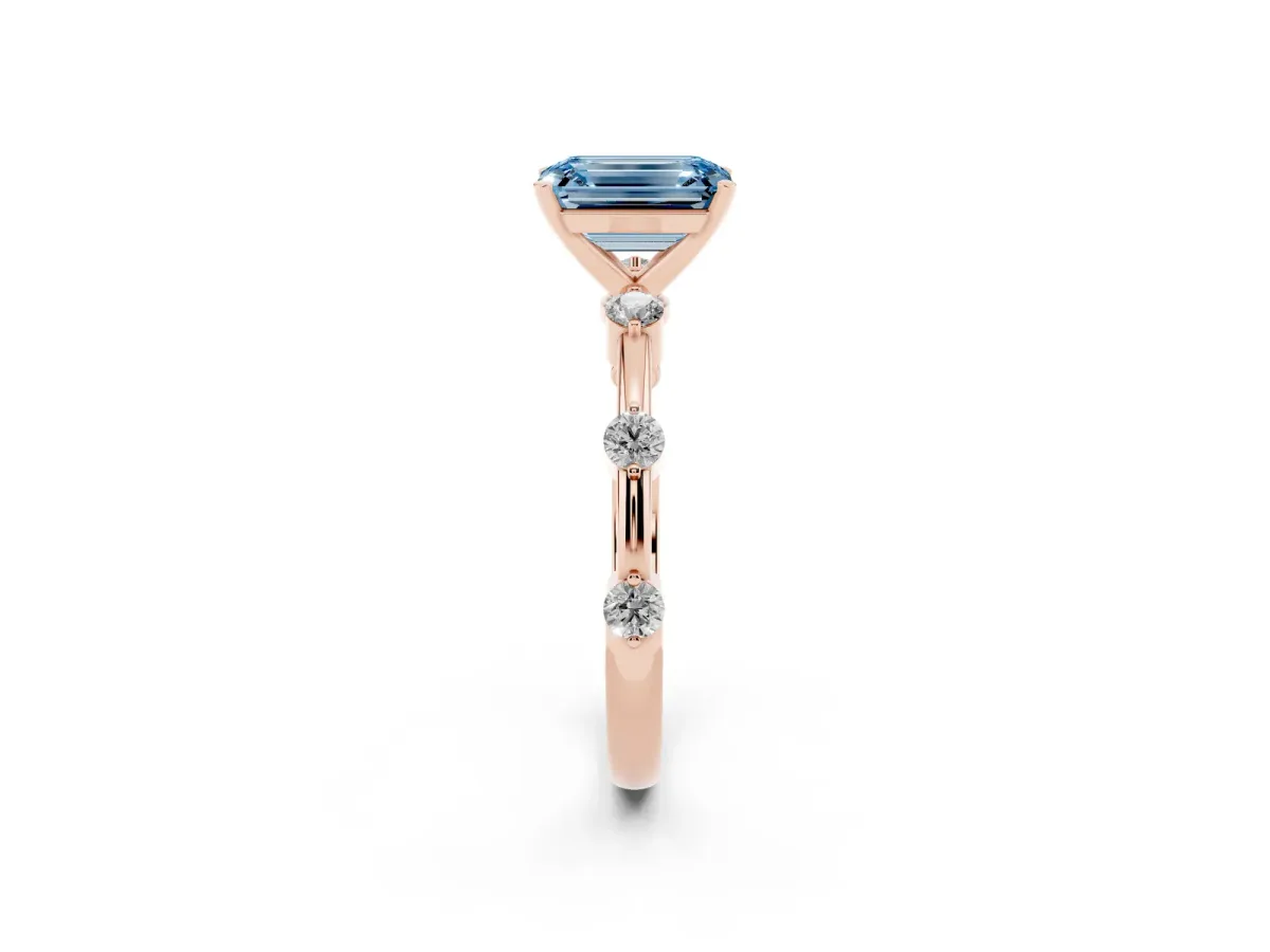 Fancy Blue Emerald Cut Solitaire Diamond Ring with Bezel Set Side Stones and Prong Setting Rose gold