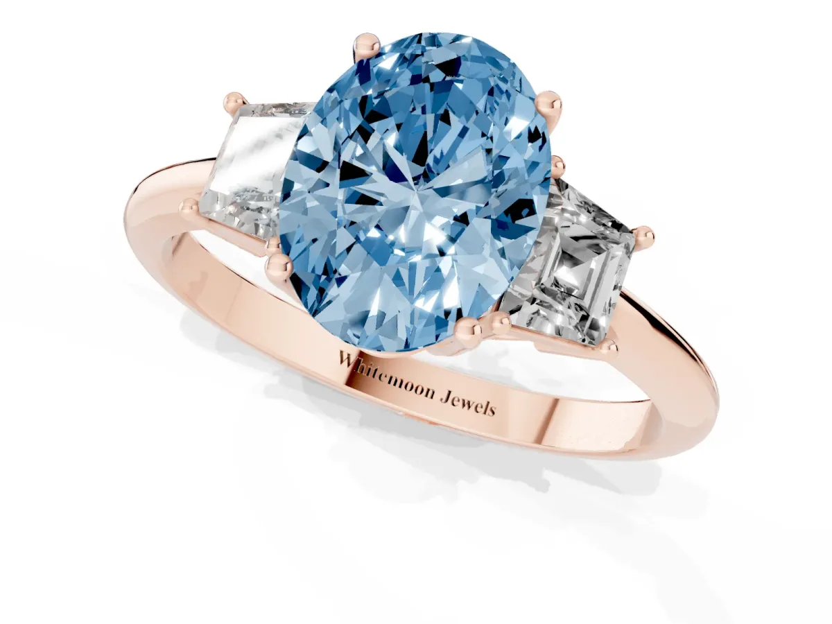 Fancy Blue Oval Cut Diamond Three-Stone Ring with Trapezoid Side Stones and Prong Setting Rose gold