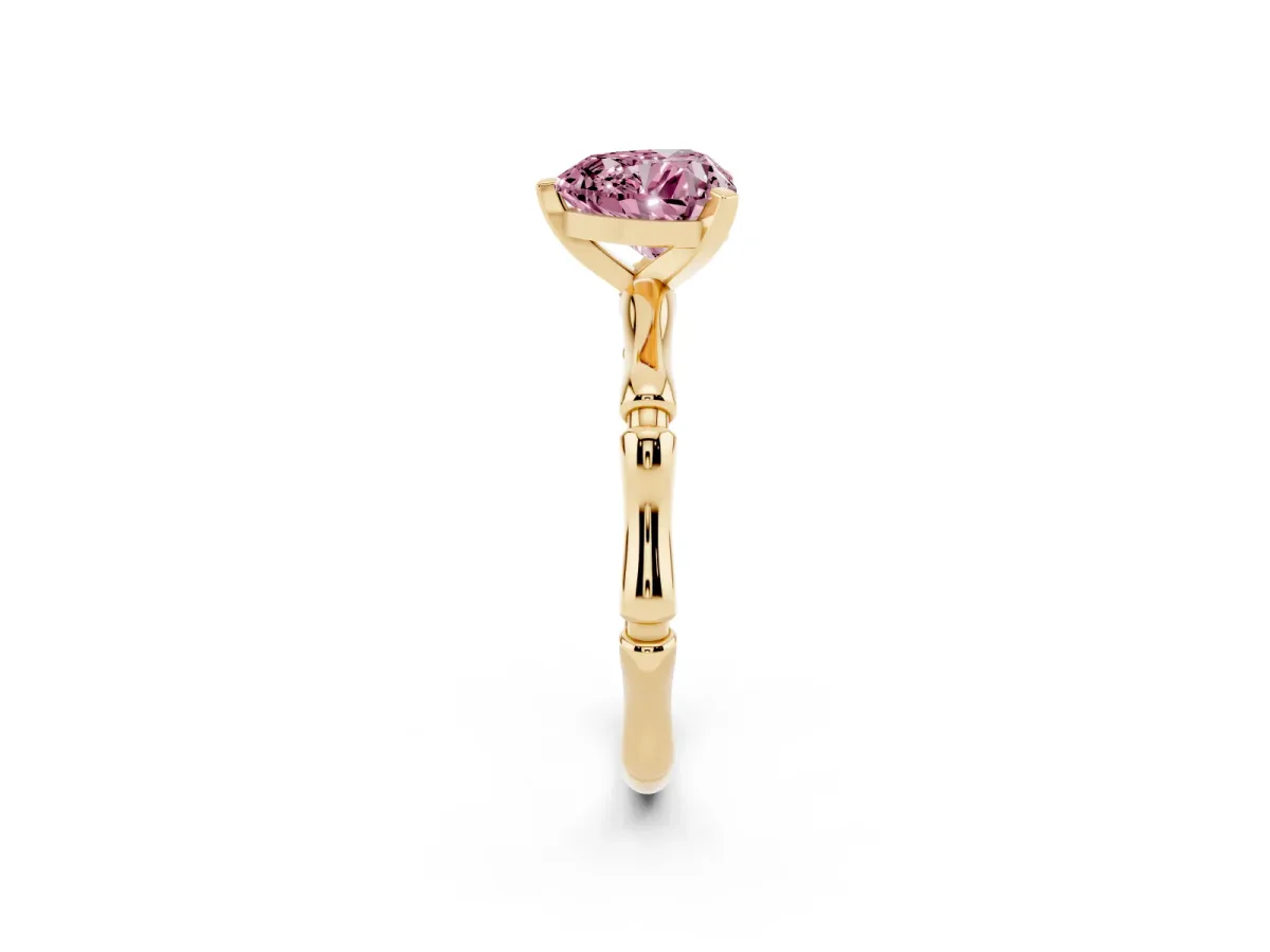Fancy Pink Heart Cut Solitaire Diamond Ring with Bamboo Band and Four-Prong Setting Yellow gold
