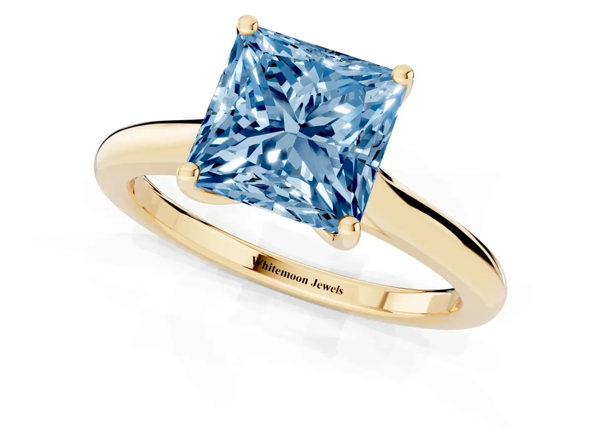Fancy Blue Princess Cut Cut Solitaire Ring with Cathedral Band and Four-Prong Setting Yellow gold