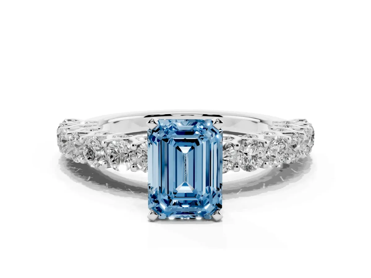 Fancy Blue Emerald Cut Diamond Solitaire Ring with Shared Prong Pavé Band and Four-Prong Setting Silver