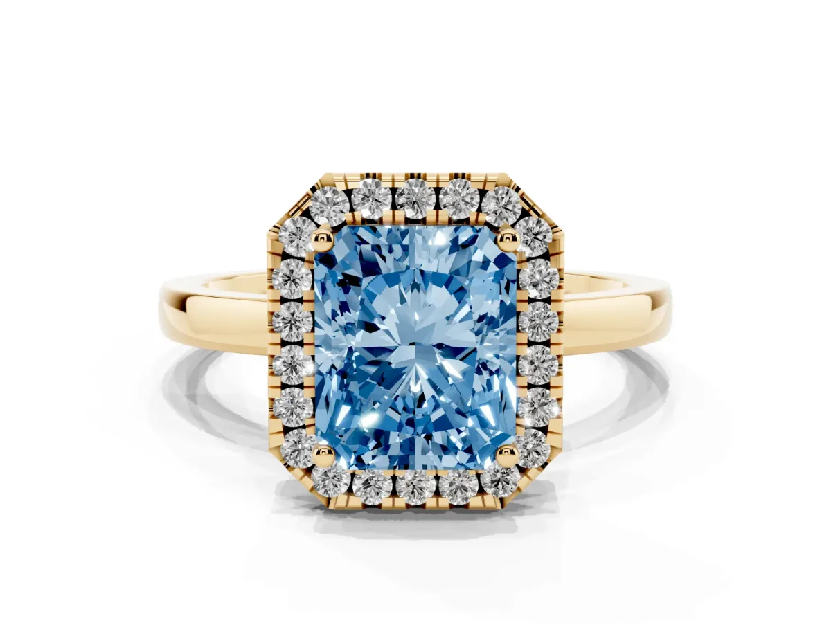 Fancy Blue Radiant Cut Halo Diamond Solitaire with Pavé Band and Four-Prong Setting Yellow gold