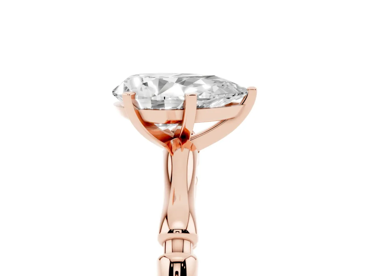 Pear Cut Solitaire Diamond Ring with Bamboo Band and Four-Prong Setting Rose gold