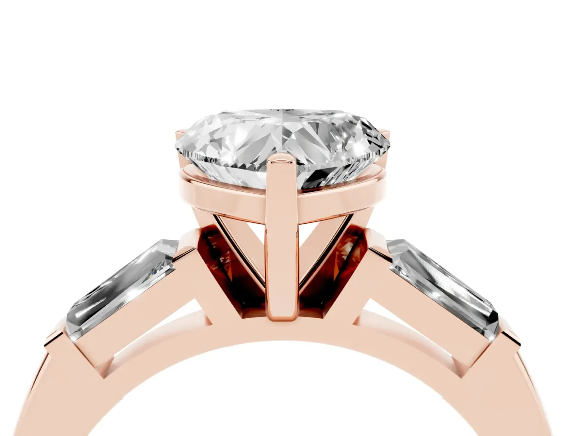 Heart Cut Solitaire with Tapered Baguette Side Stones on a Classic Band with Four-Prong Setting Rose gold