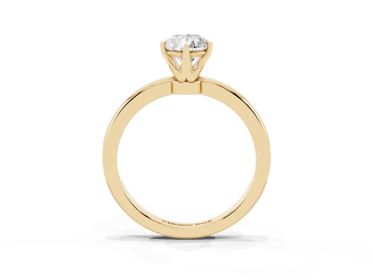 Pear Cut Solitaire Diamond Ring with Six-Prong Setting on a Classic Band Yellow gold