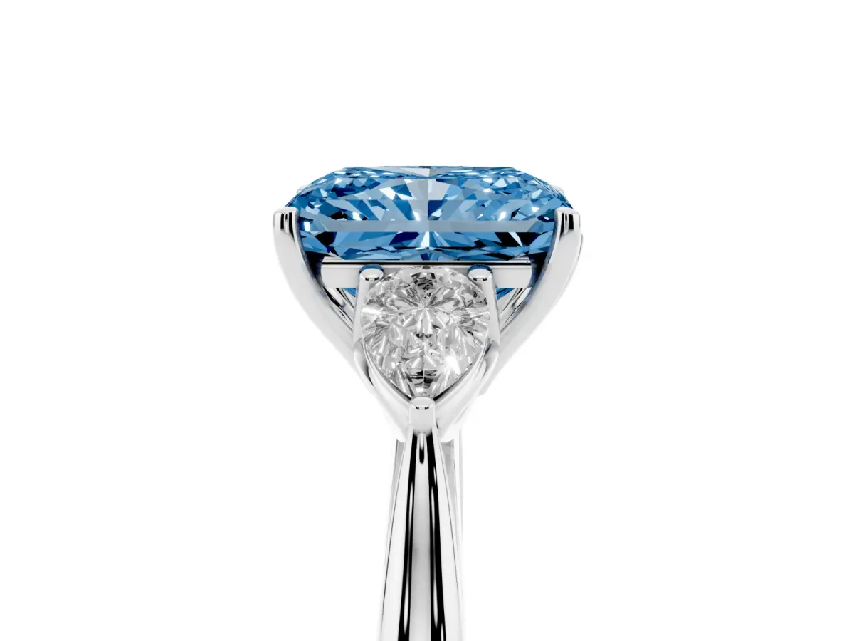 Fancy Blue Three-Stone Radiant Cut Brilliant Diamond Solitaire Ring with Tapered Band and Four-Prong Setting Platinum